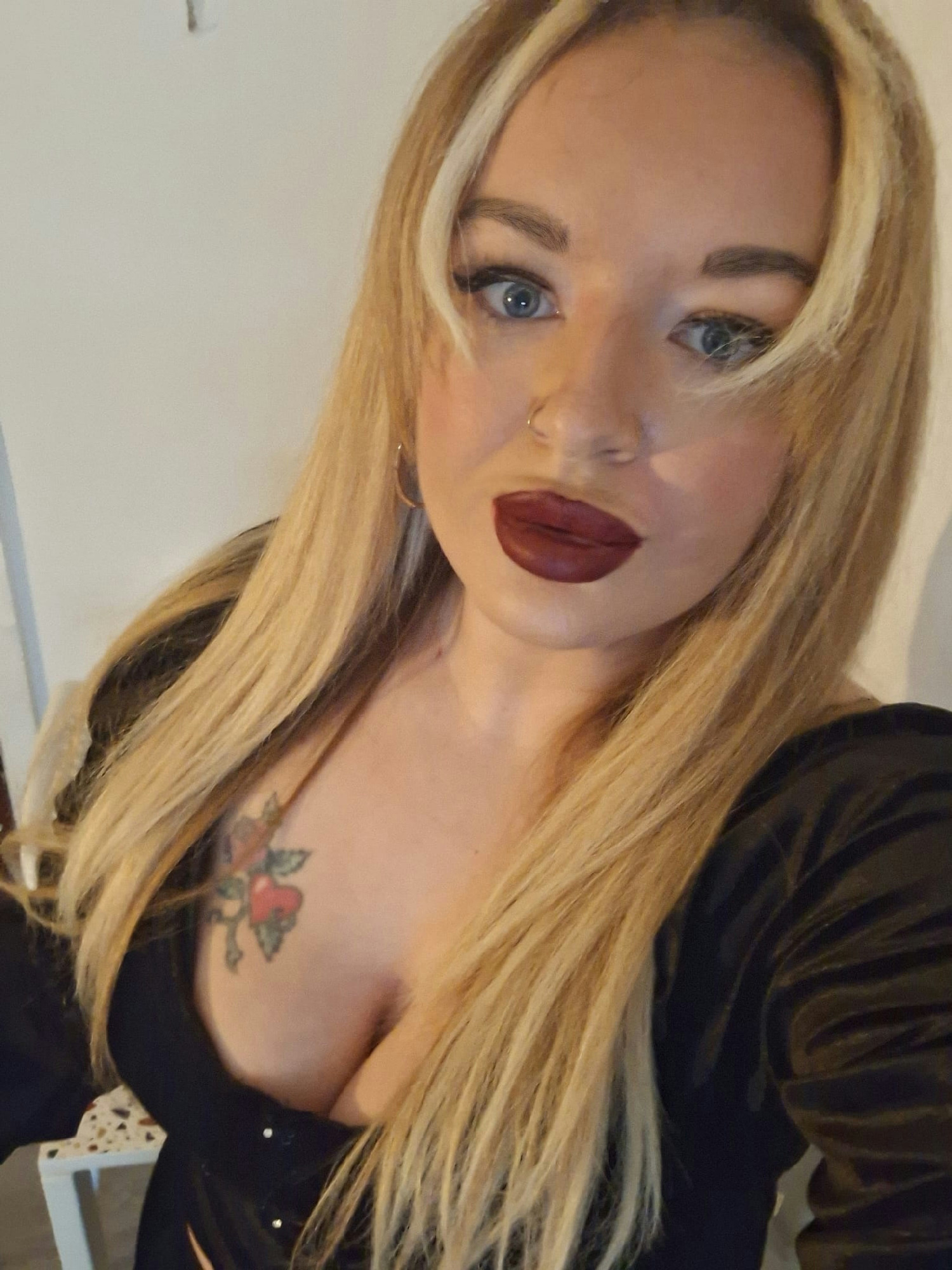 The camera remains static, maintaining the intimate selfie framing. The fixed camera does not freeze the subjects: the …