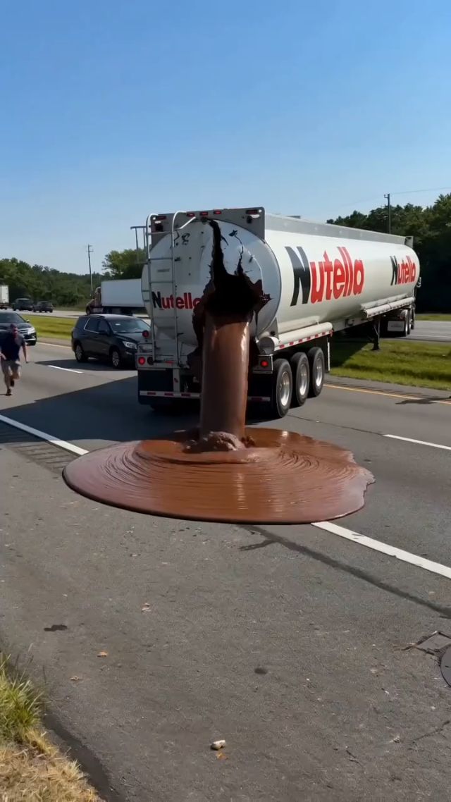 A crashed Nutella tanker truck is stopped on the side of a highway in bright daylight, with a huge burst of thick chocolate hazelnut spre...
